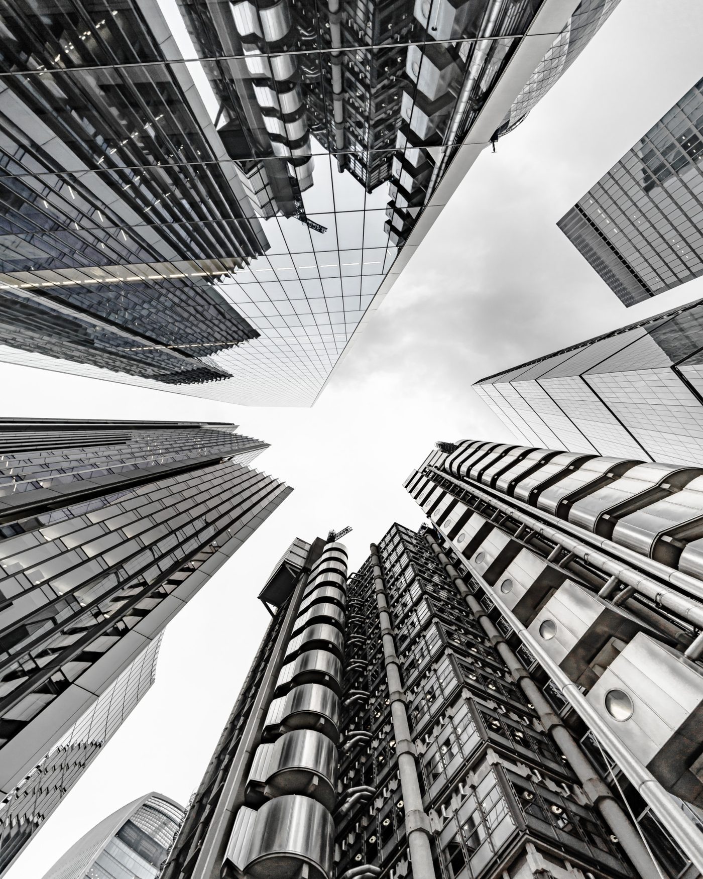 Glass and steel towers photographed looking straight up between them
