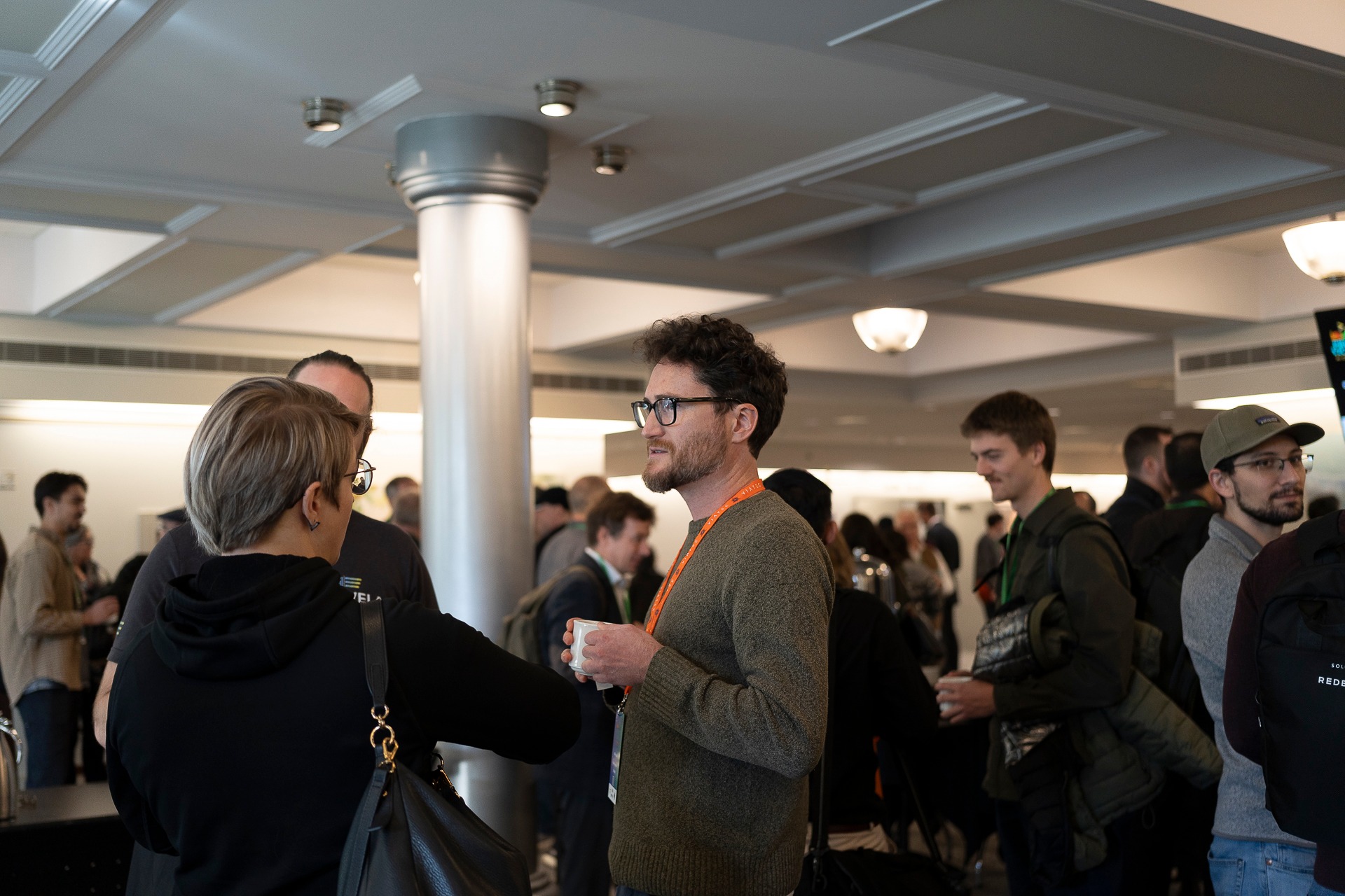 Attendees networking during a break